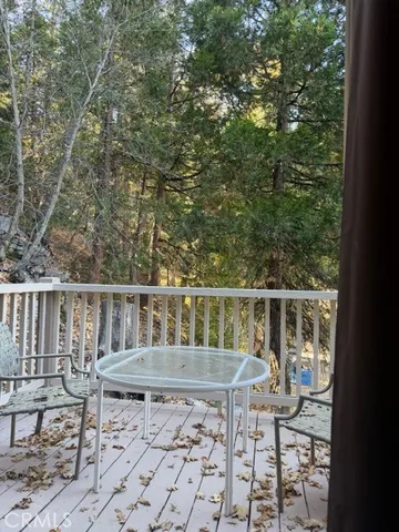 a view of a chairs and table in the balcony