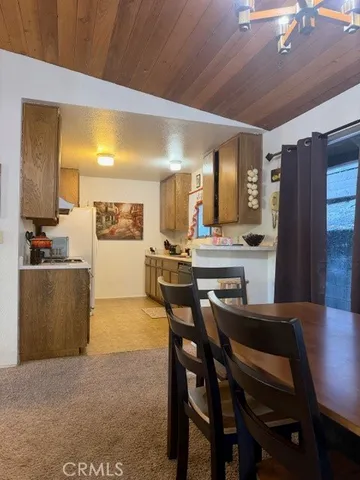 a kitchen with a table and chairs in it