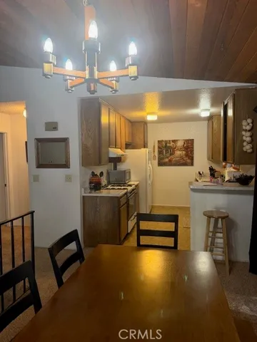 a view of kitchen with furniture and counter space