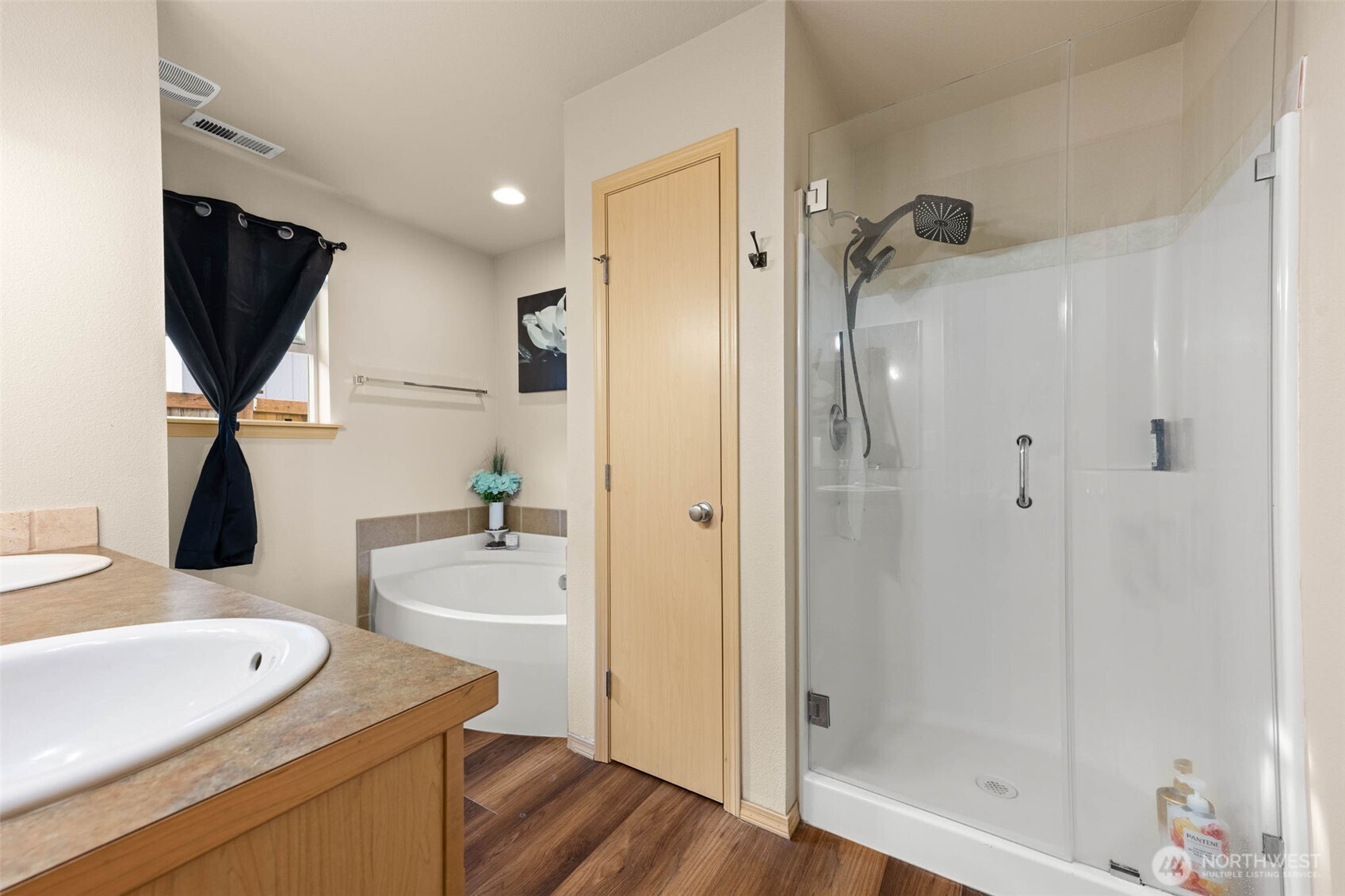 20009 96th Avenue East Graham, WA 98338 - Photo 17 of 40 a bathroom with a sink a toilet and shower