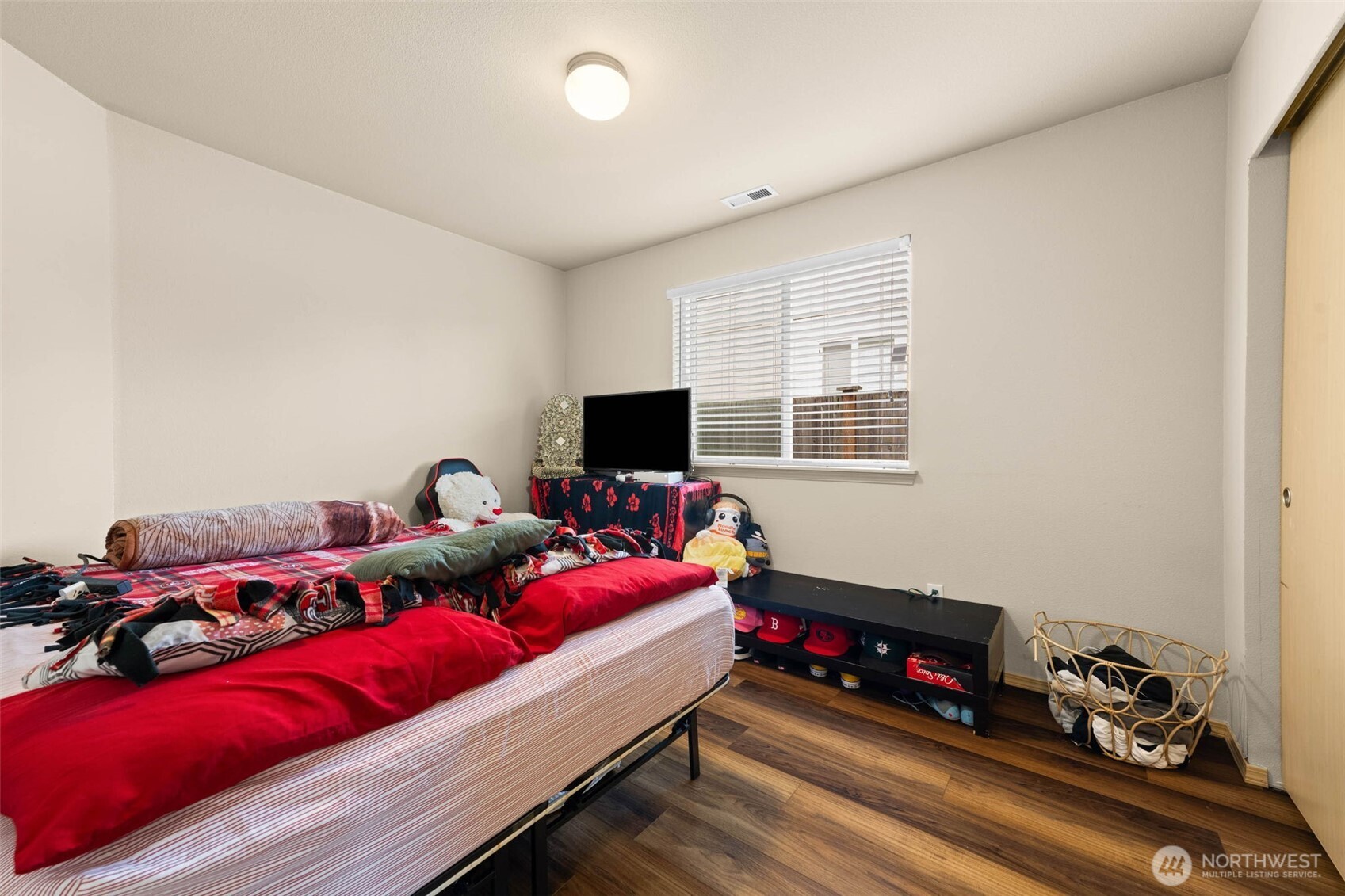 20009 96th Avenue East Graham, WA 98338 - Photo 22 of 40 a living room with furniture and a flat screen tv