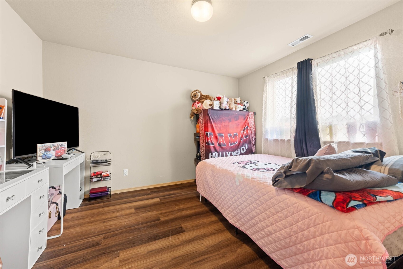 20009 96th Avenue East Graham, WA 98338 - Photo 23 of 40 a bedroom with a bed and a flat screen tv