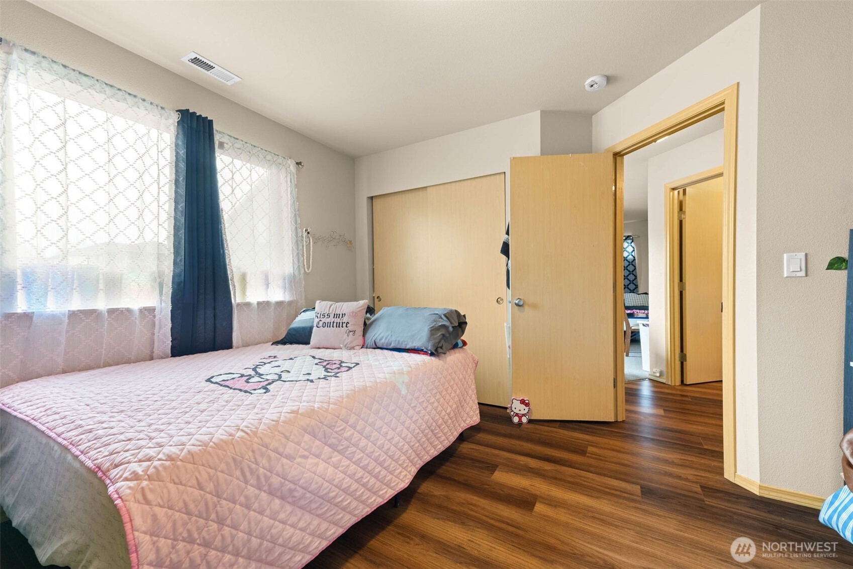 20009 96th Avenue East Graham, WA 98338 - Photo 24 of 40 a bedroom with a bed and wooden floor