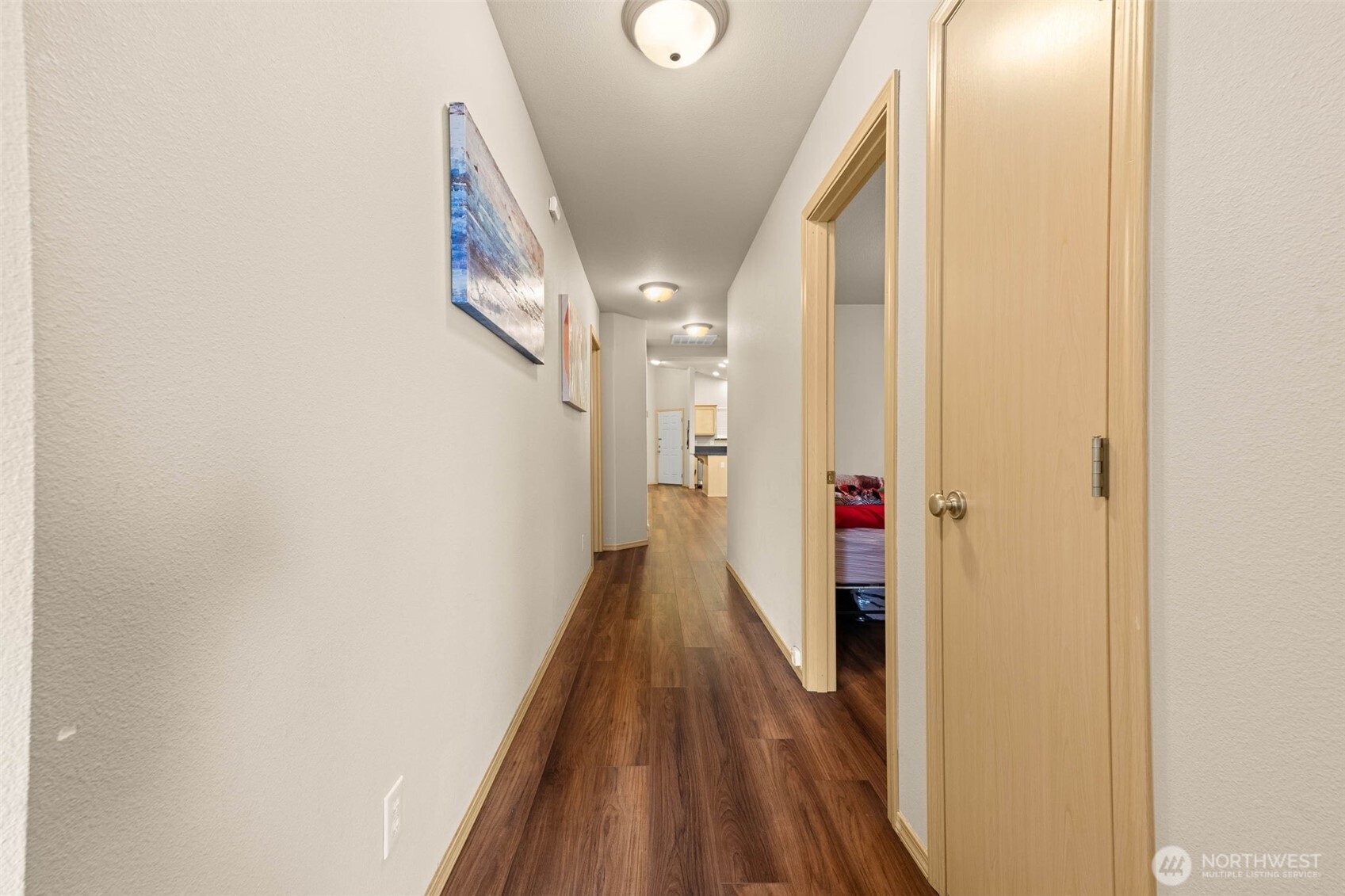 20009 96th Avenue East Graham, WA 98338 - Photo 27 of 40 a view of a hallway with wooden floor and staircase