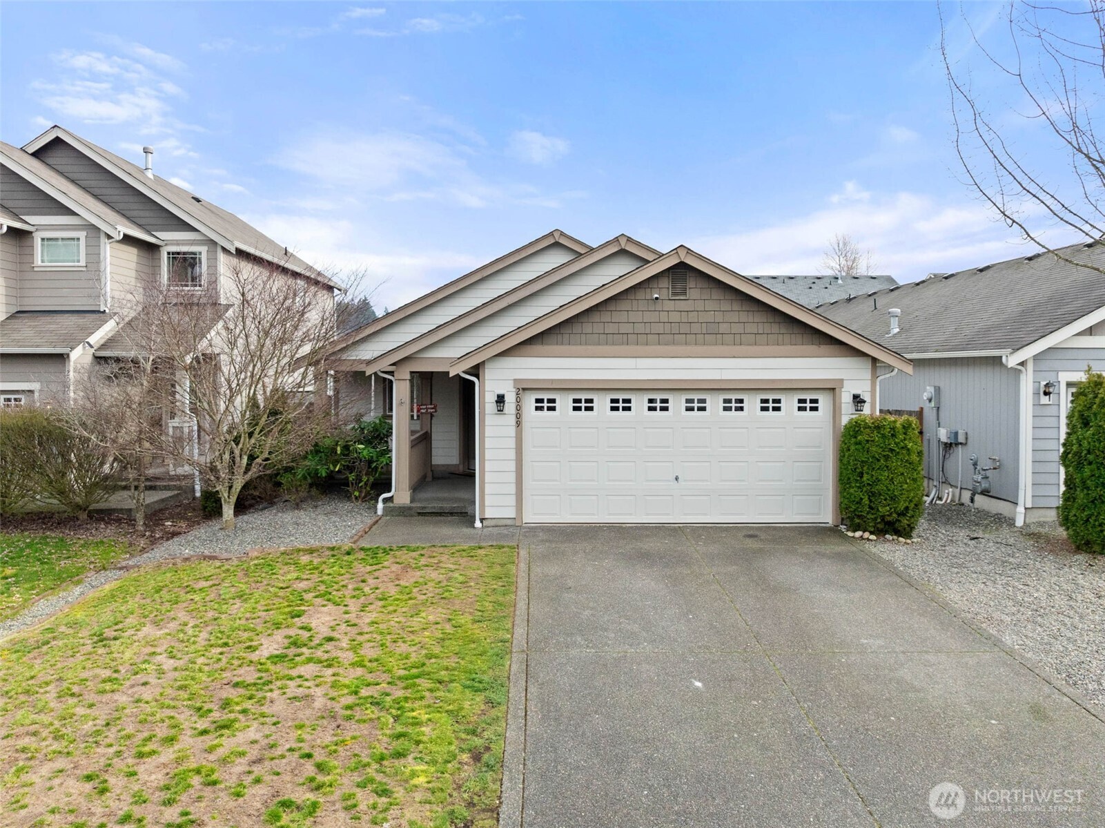 20009 96th Avenue East Graham, WA 98338 - Photo 3 of 40 a view of a house with a big yard and large tree