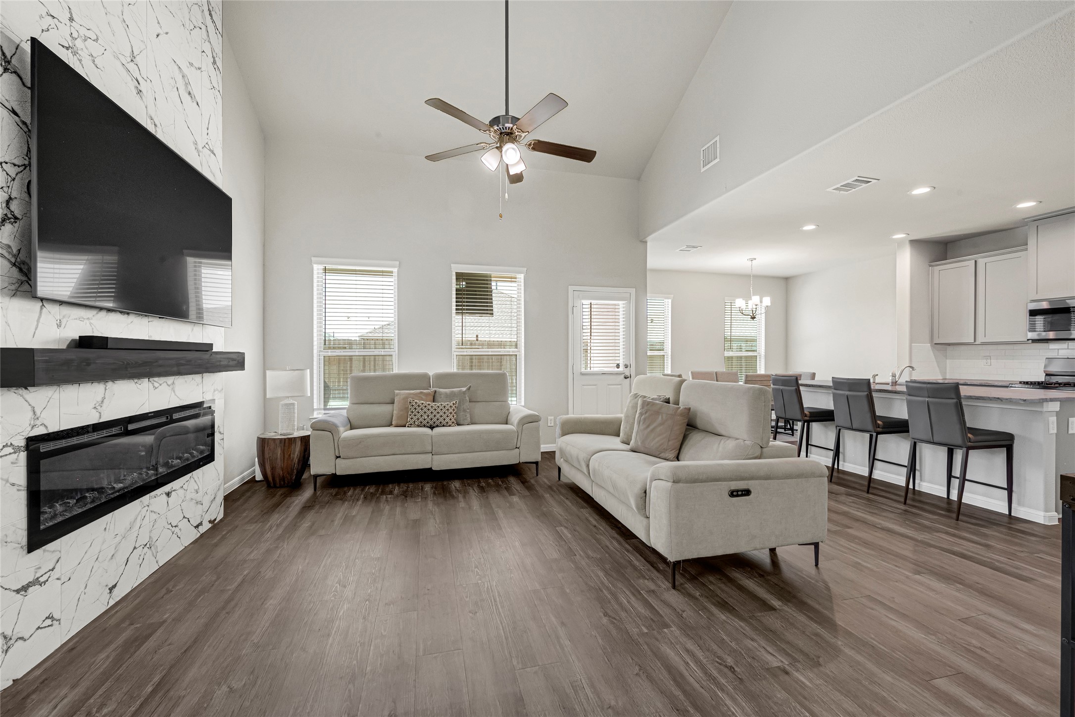 4206 Fenwick Road Texas City, TX 77591 - Photo 5 of 26 The ample-sized open living room features a beautiful custom-made electric fireplace that is tiled up to the second floor!