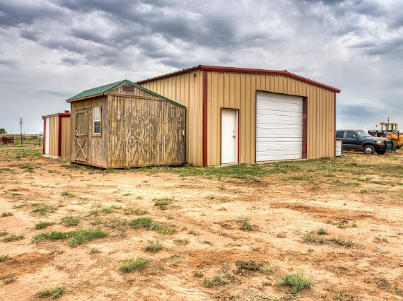 6341 Farm Private Road Levelland, TX 79336 - Photo 35 of 46 a view of a house with backyard and trees