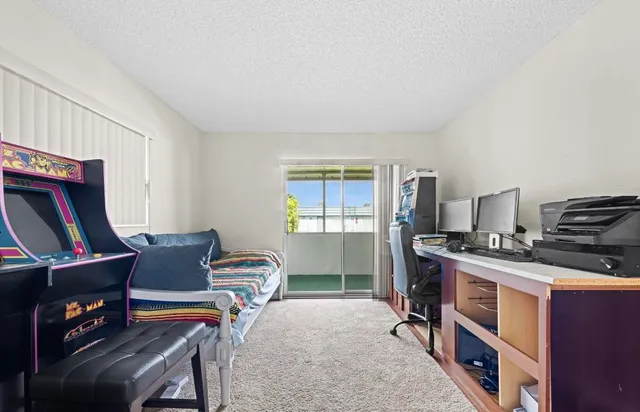 a workspace with furniture and a piano