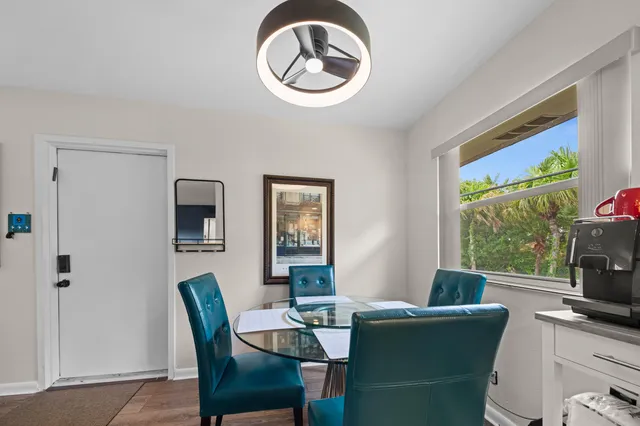 a dining room with furniture and window