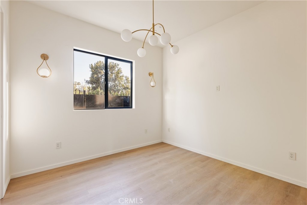 17852 Saticoy Street Reseda, CA 91335 - Photo 23 of 28 a view of an empty room with a window