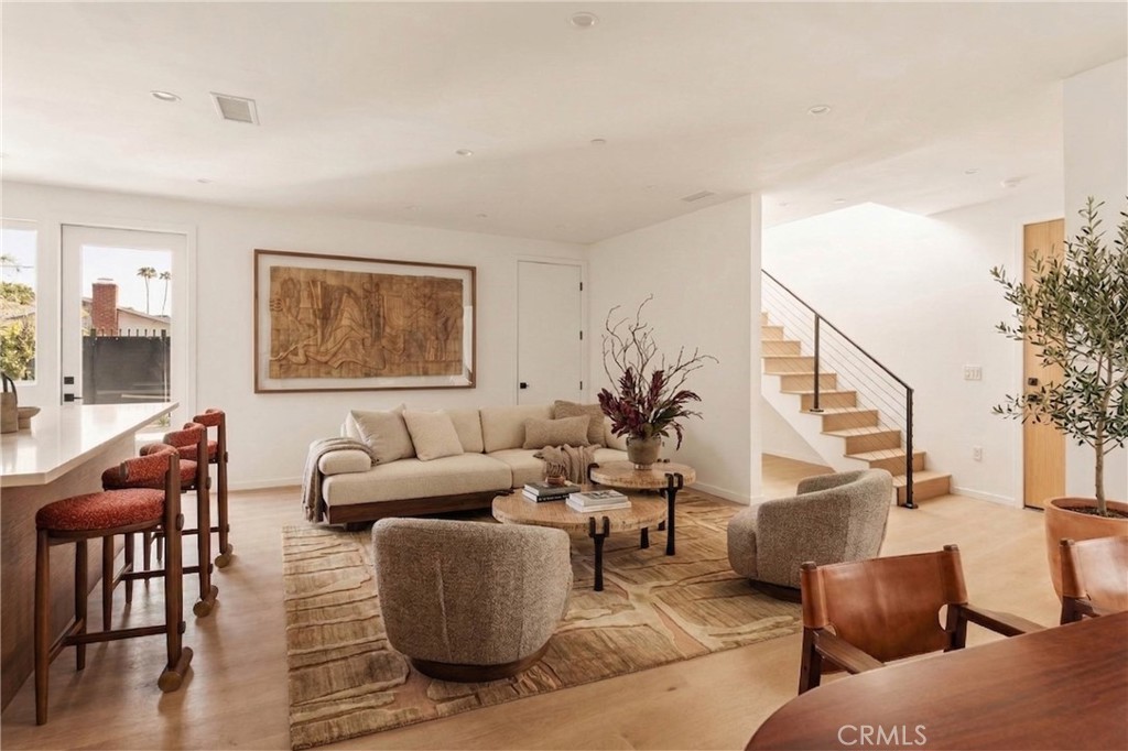 17852 Saticoy Street Reseda, CA 91335 - Photo 4 of 28 a living room with furniture wooden floor and a flat screen tv