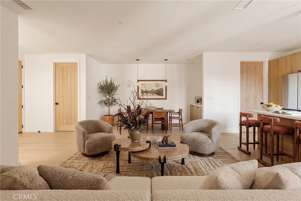 17852 Saticoy Street Reseda, CA 91335 - Photo 5 of 28 a living room with furniture and wooden floor