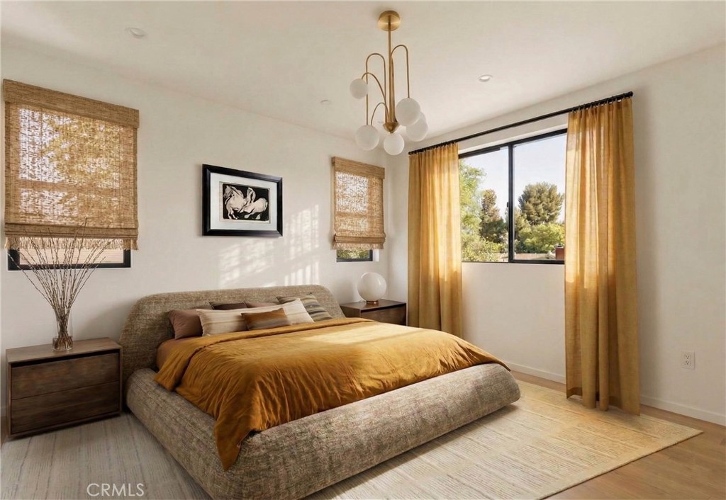 17852 Saticoy Street Reseda, CA 91335 - Photo 8 of 28 a bedroom with a large bed and a window