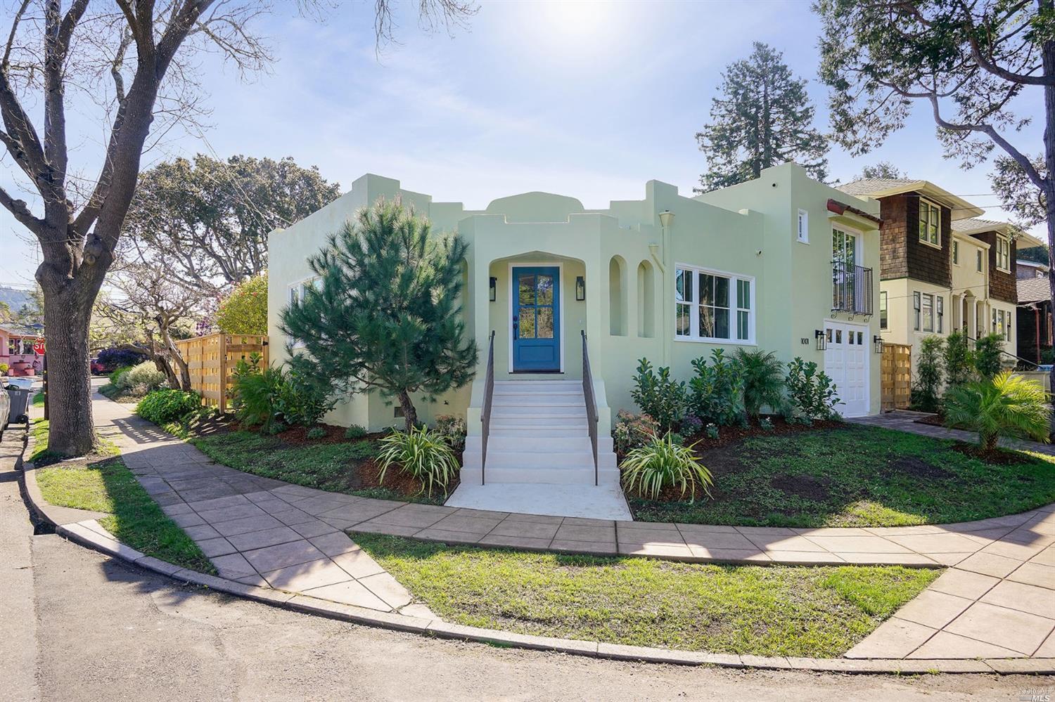 a front view of a house with garden