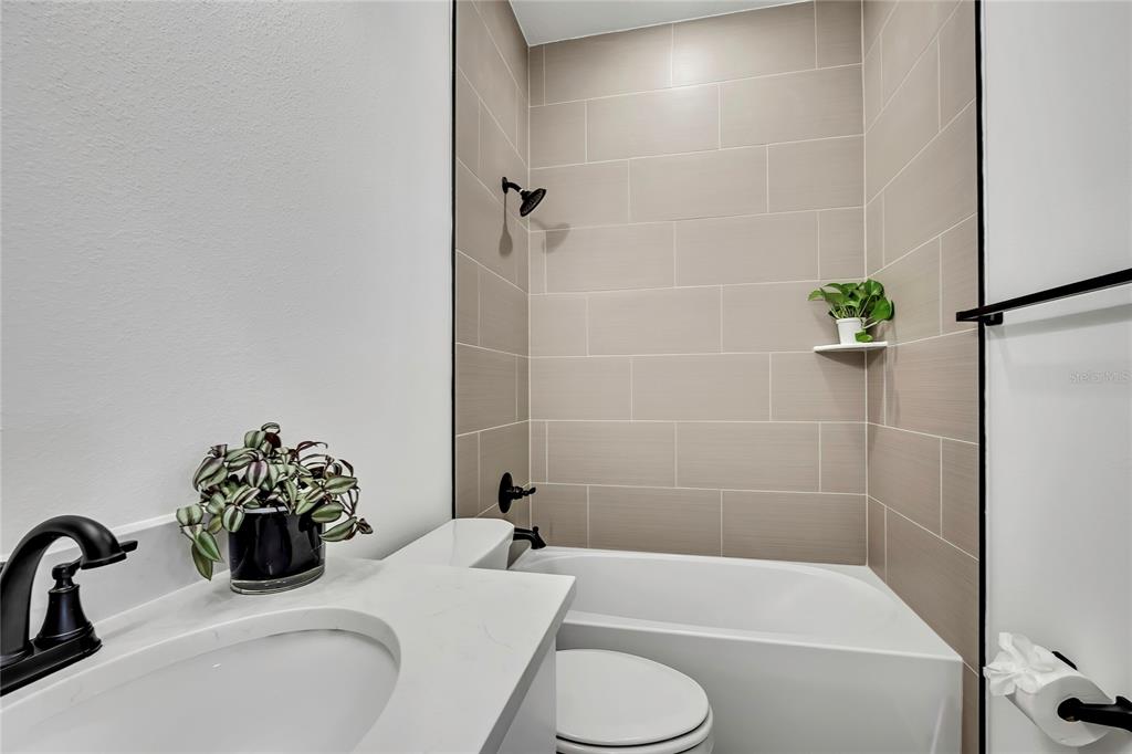 6589 Freeport Drive Spring Hill, FL 34608 - Photo 19 of 57 a bathroom with a sink and a bathtub