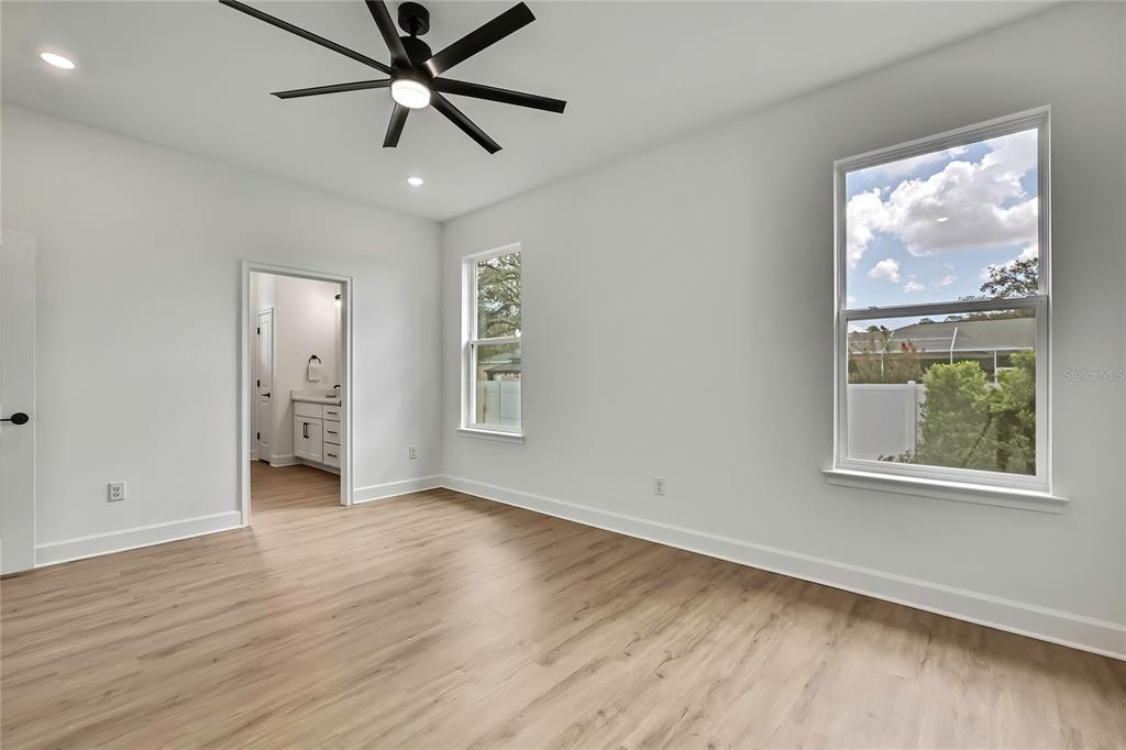 6589 Freeport Drive Spring Hill, FL 34608 - Photo 29 of 57 wooden floor in an empty room with a window