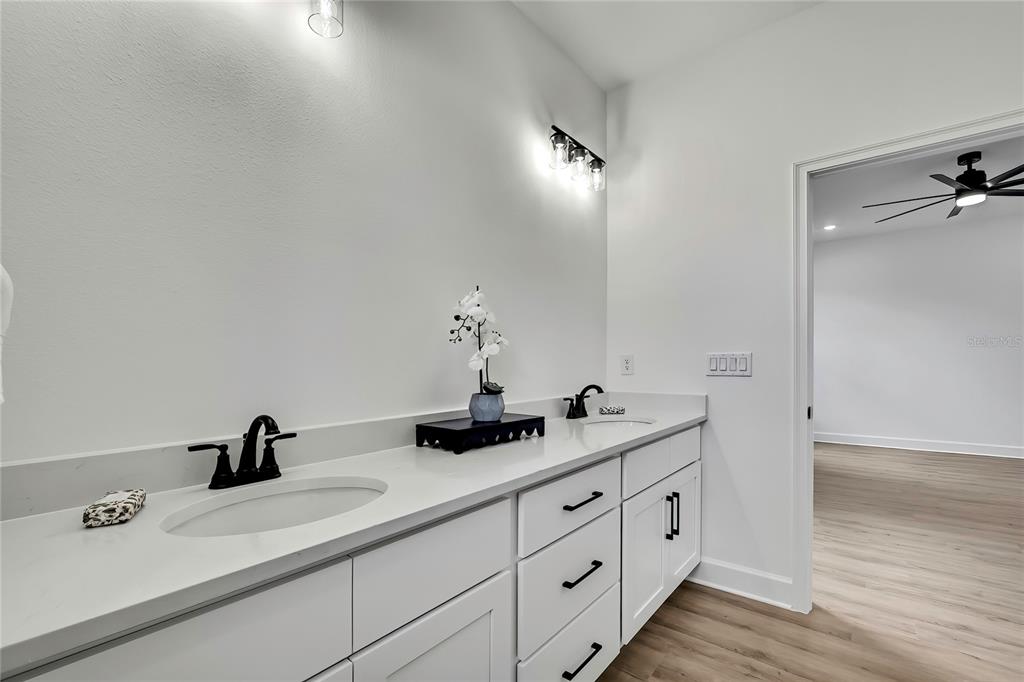 6589 Freeport Drive Spring Hill, FL 34608 - Photo 34 of 57 a bathroom with a sink and a mirror