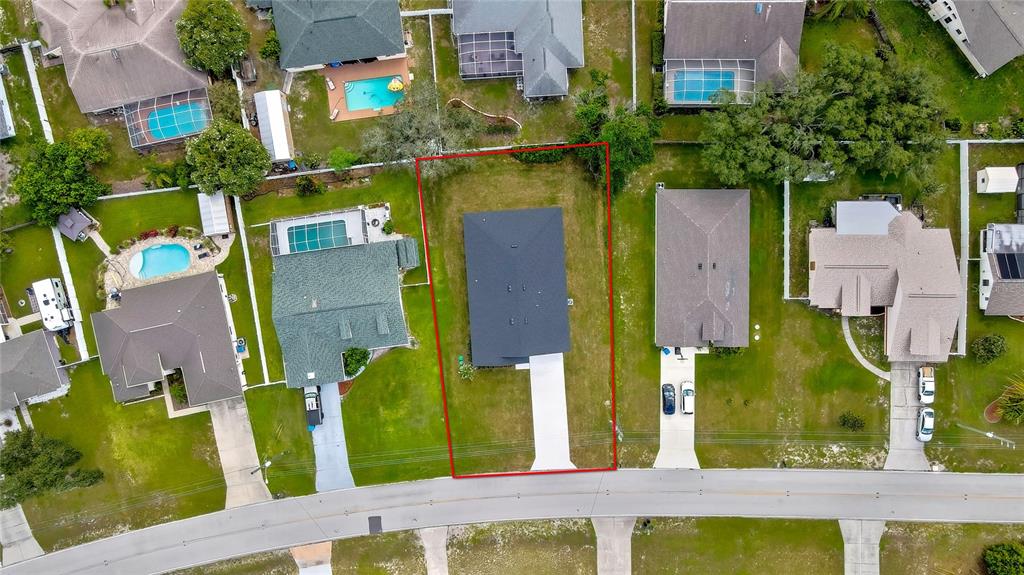 6589 Freeport Drive Spring Hill, FL 34608 - Photo 38 of 57 an aerial view of houses with outdoor space