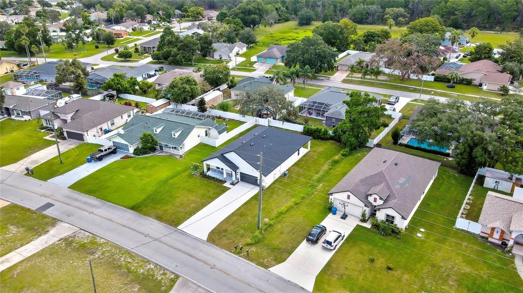 6589 Freeport Drive Spring Hill, FL 34608 - Photo 50 of 57 an aerial view of a pool yard patio and outdoor seating