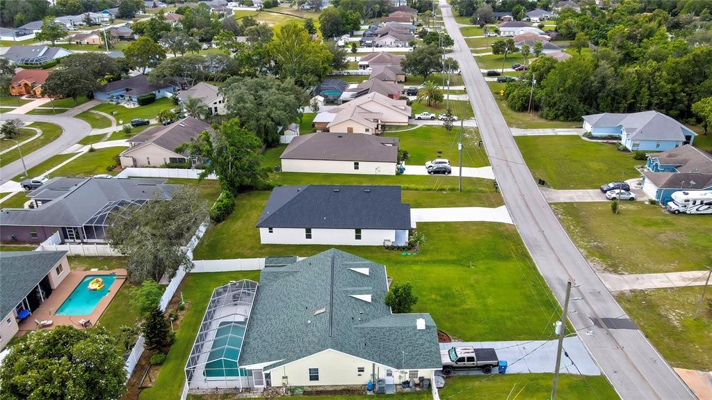 6589 Freeport Drive Spring Hill, FL 34608 - Photo 55 of 57 an aerial view of multiple houses with yard
