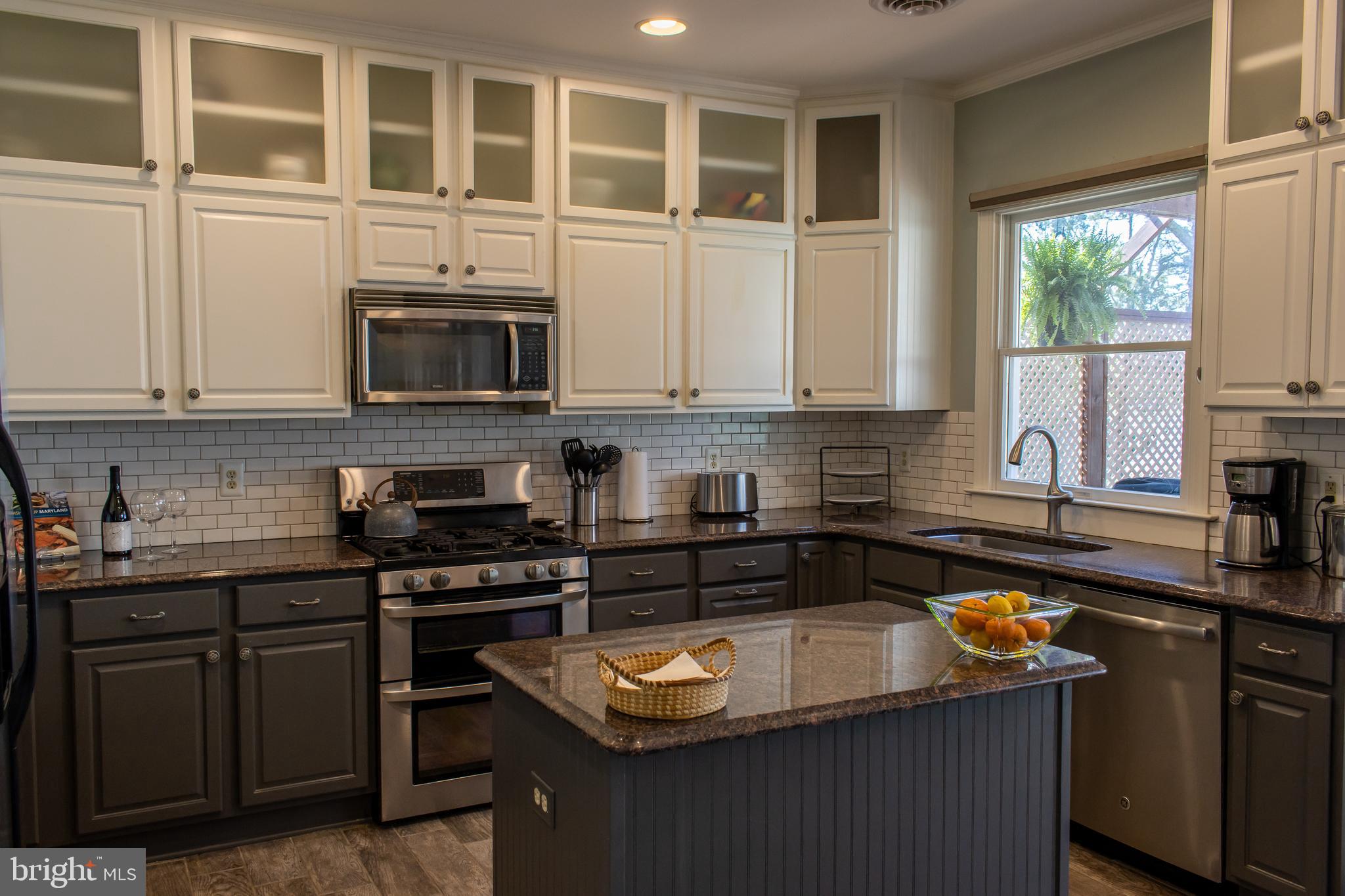 1020 River Point Road Cambridge, MD 21613 - Photo 13 of 45 Center Island Kitchen with subway tile backsplash