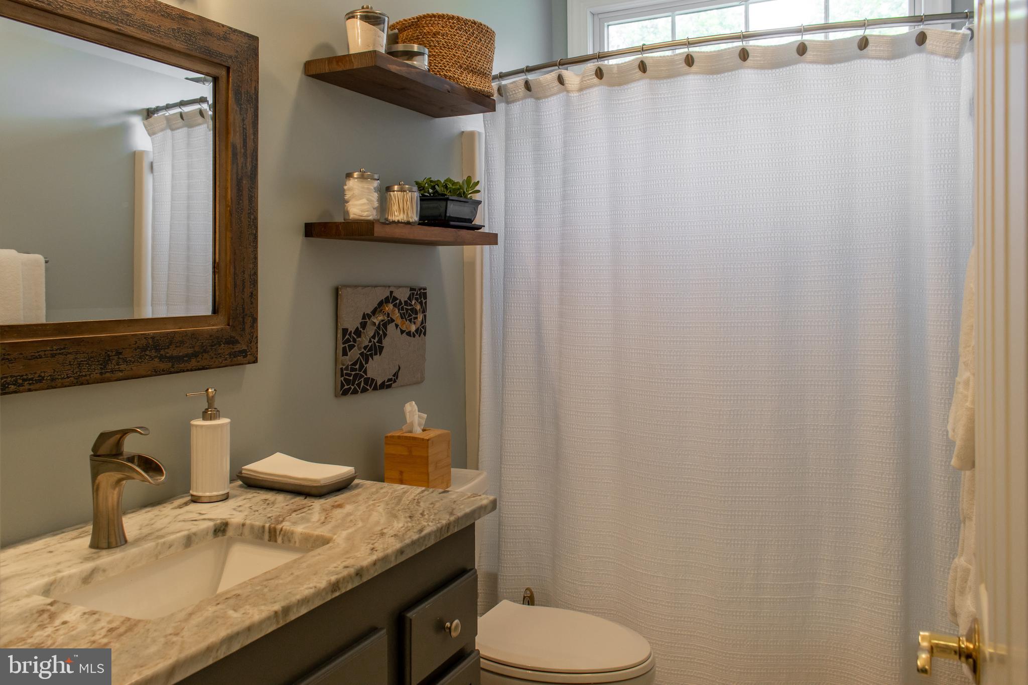 1020 River Point Road Cambridge, MD 21613 - Photo 26 of 45 Hall bath with beautiful vanity & transom window