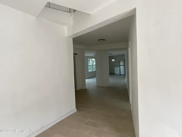 a view of an empty room and window