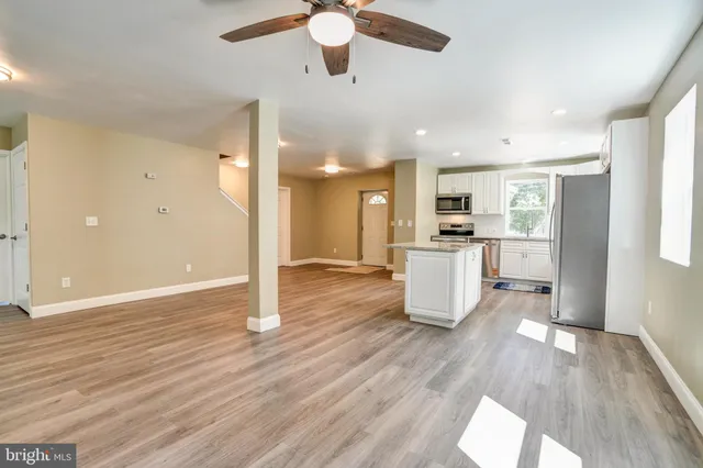a view of a kitchen cabinets and wooden floor