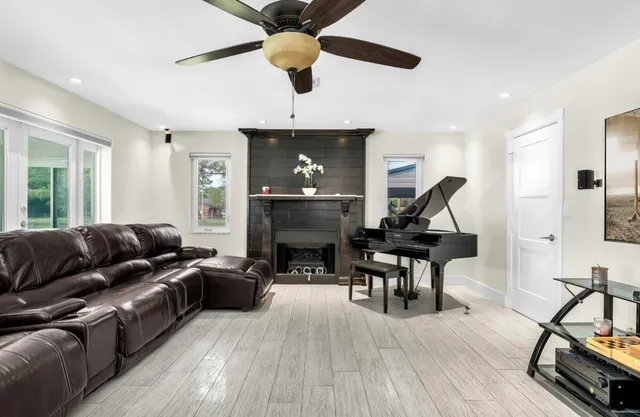 a living room with furniture and a fireplace