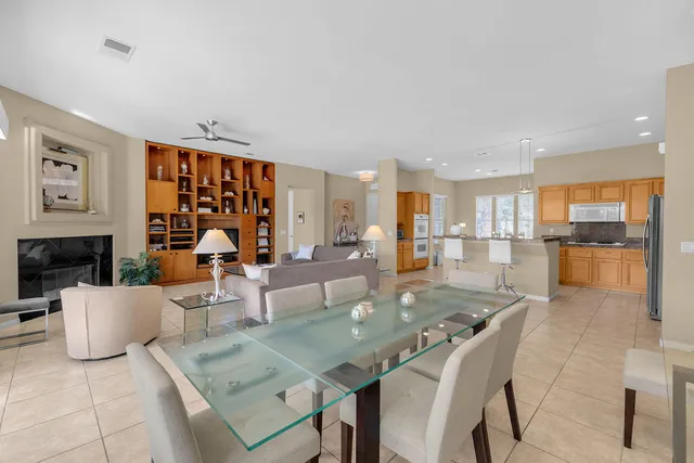 a large white kitchen with a large window