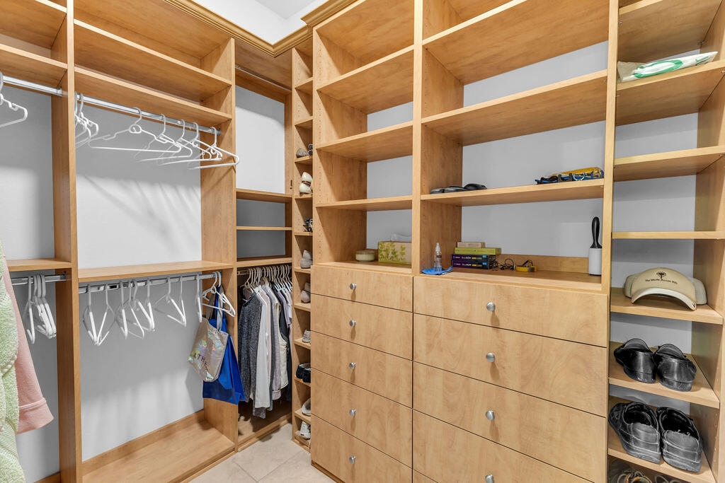 29 Calle La Reina Rancho Mirage, CA 92270 - Photo 23 of 49 a view of walk in closet with clothes and shoes