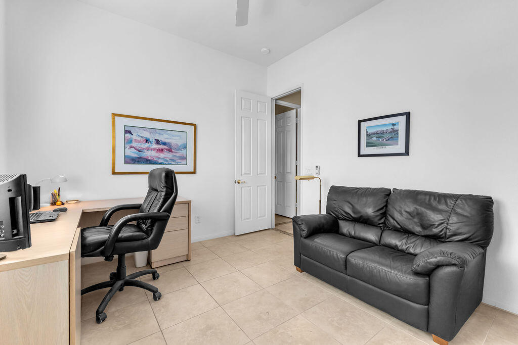 29 Calle La Reina Rancho Mirage, CA 92270 - Photo 27 of 49 a living room with furniture and a piano