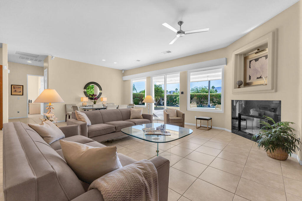 29 Calle La Reina Rancho Mirage, CA 92270 - Photo 7 of 49 a living room with furniture and a fireplace