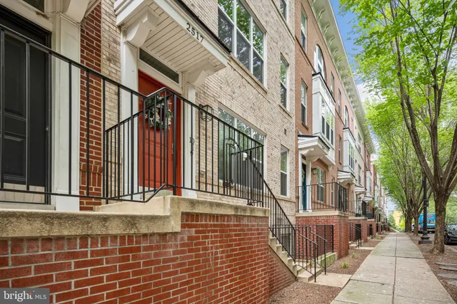 a view of a brick building with many windows