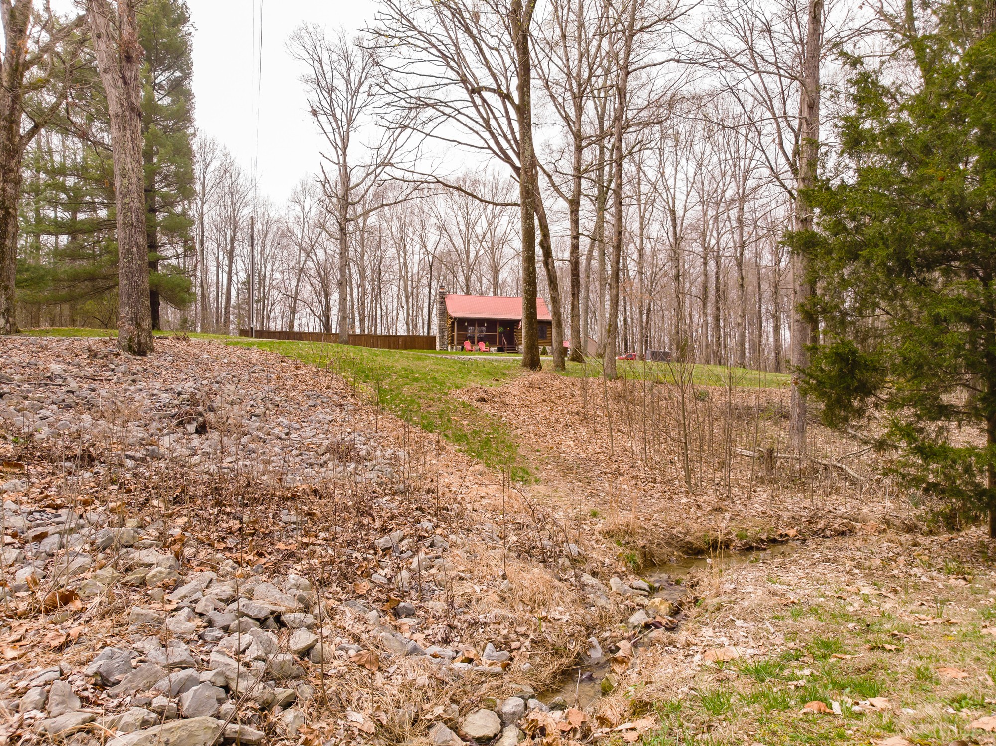 2342 Gideon Road Greenbrier, TN 37073 - Photo 4 of 38 a backyard of a house with large trees and outdoor seating