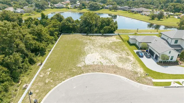 a view of a swimming pool with a yard