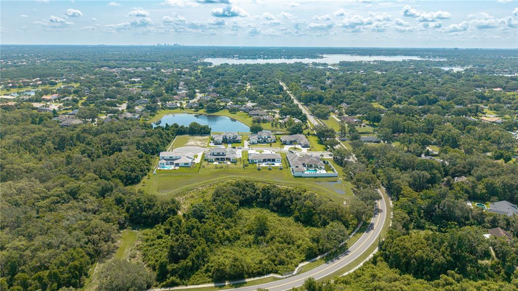 2504 Windermere Reserve Court Windermere, FL 34786 - Photo 15 of 26 an aerial view of residential houses with outdoor space and trees