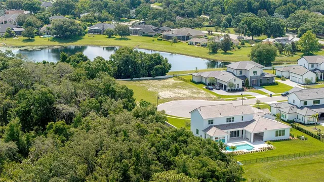 an aerial view of a house with a swimming pool