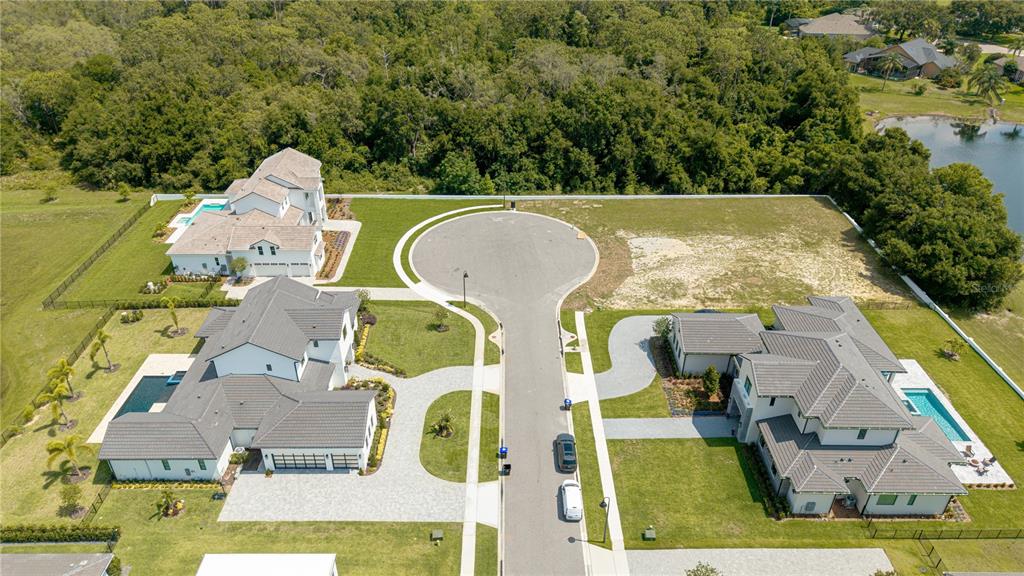 2504 Windermere Reserve Court Windermere, FL 34786 - Photo 25 of 26 an aerial view of residential house with outdoor space and swimming pool