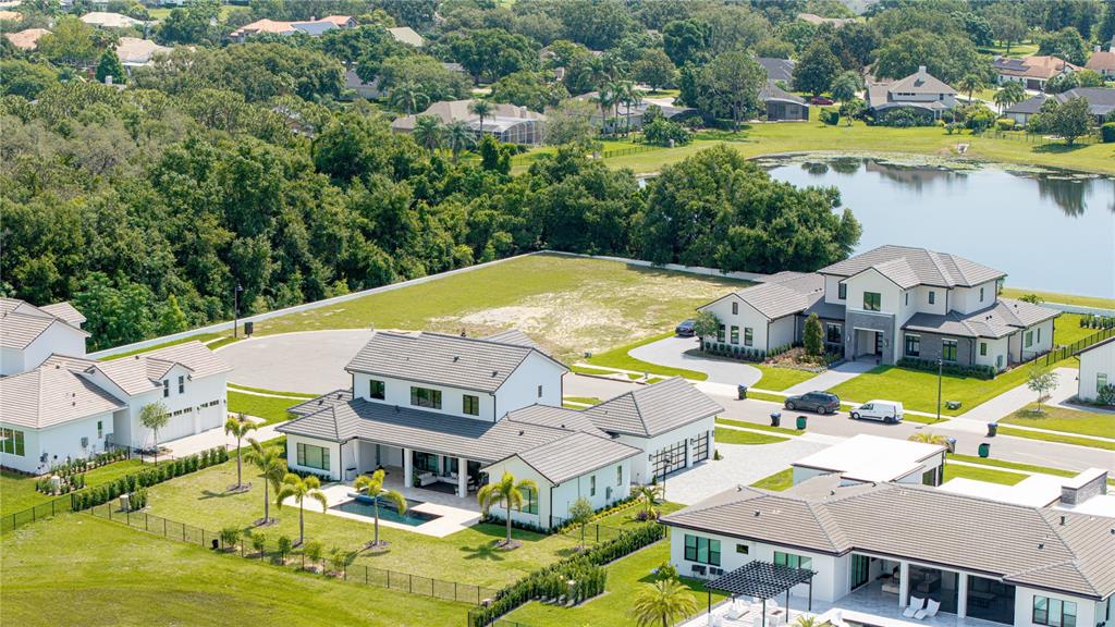 2504 Windermere Reserve Court Windermere, FL 34786 - Photo 26 of 26 an aerial view of a house with swimming pool and ocean view