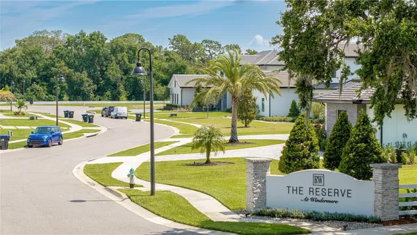 a view of a swimming pool with a yard