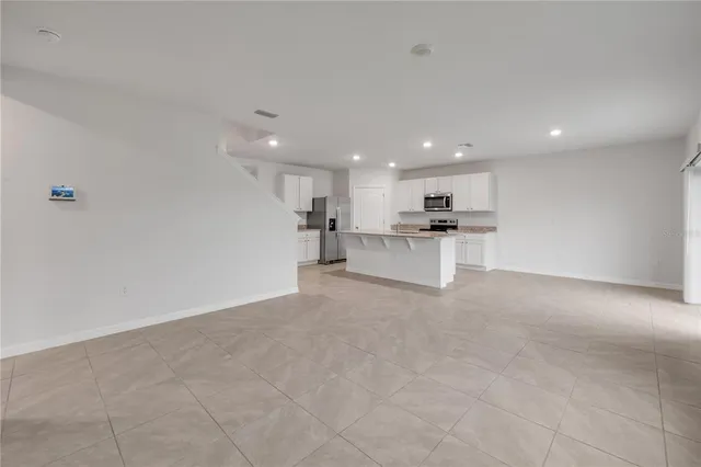 a view of a kitchen with a sink wooden floor and a kitchen view