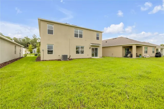 a view of a back yard of the house