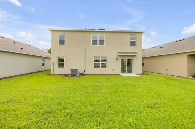 a view of a lake with a big yard