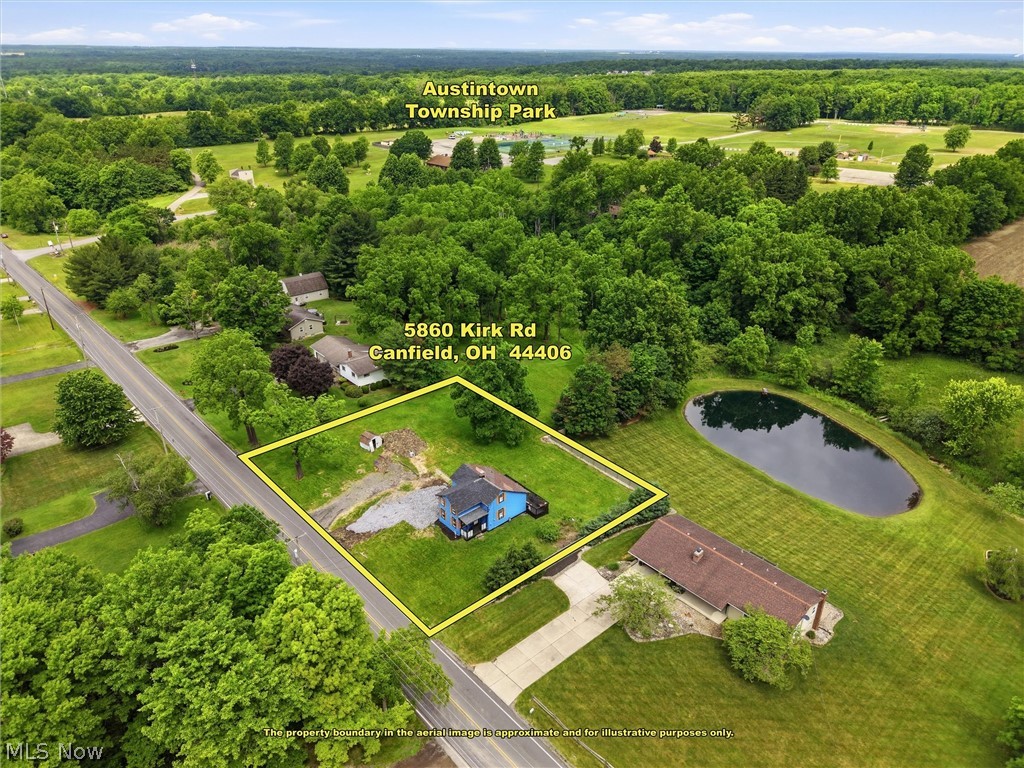5860 Kirk Road Canfield, OH 44406 - Photo 6 of 17 Aerial overview highlighting the property's rectangular lot, direct road frontage, and a blue-sided residence