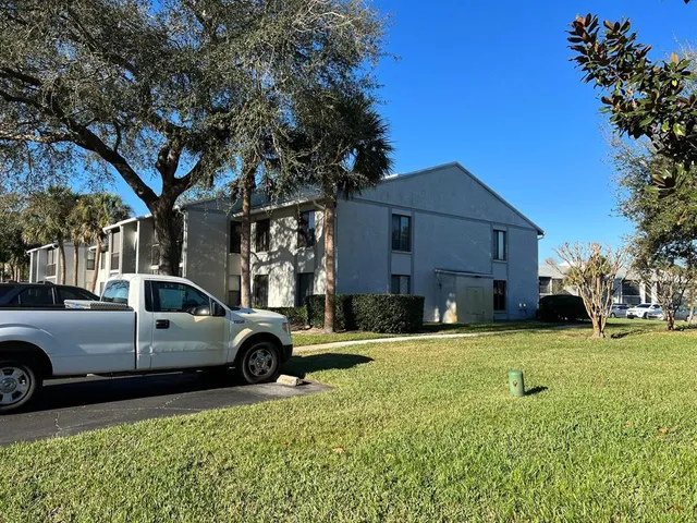 a view of a car parked in front of a house