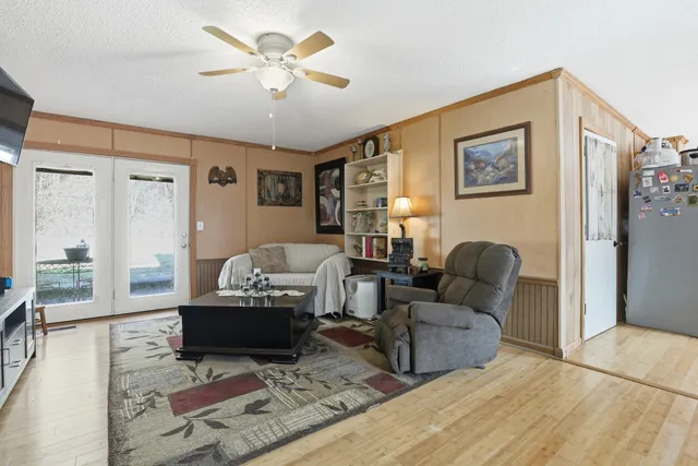 a living room with furniture and a rug