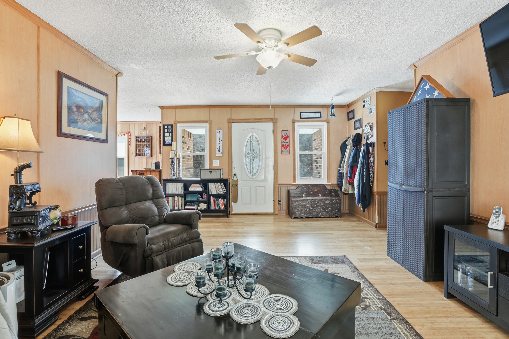 275 Lakeside Drive Carthage, TN 37030 - Photo 4 of 22 a living room with furniture a flat screen tv and a refrigerator