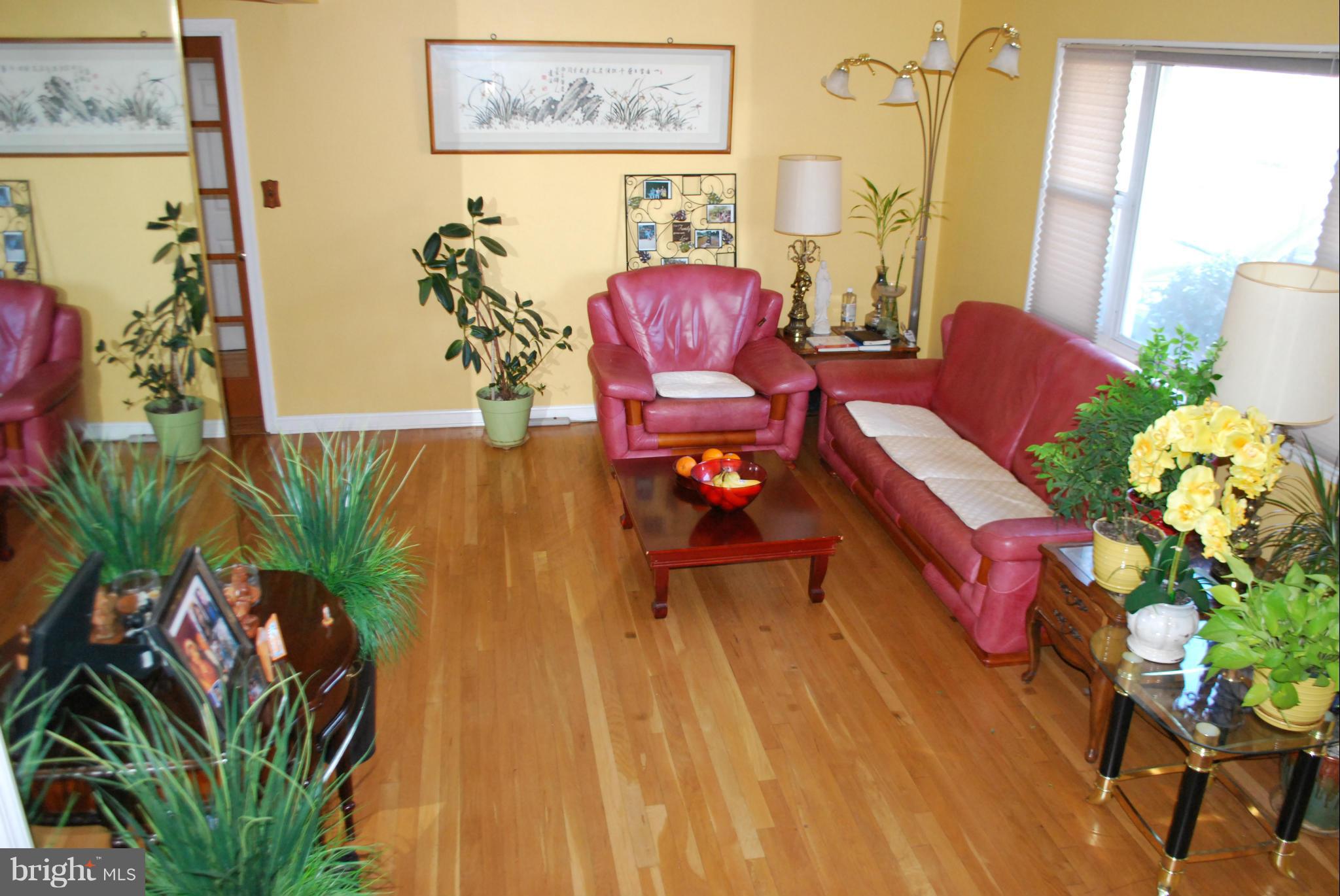 6833 Inverness Drive Springfield, VA 22150 - Photo 4 of 30 a living room with furniture and wooden floor