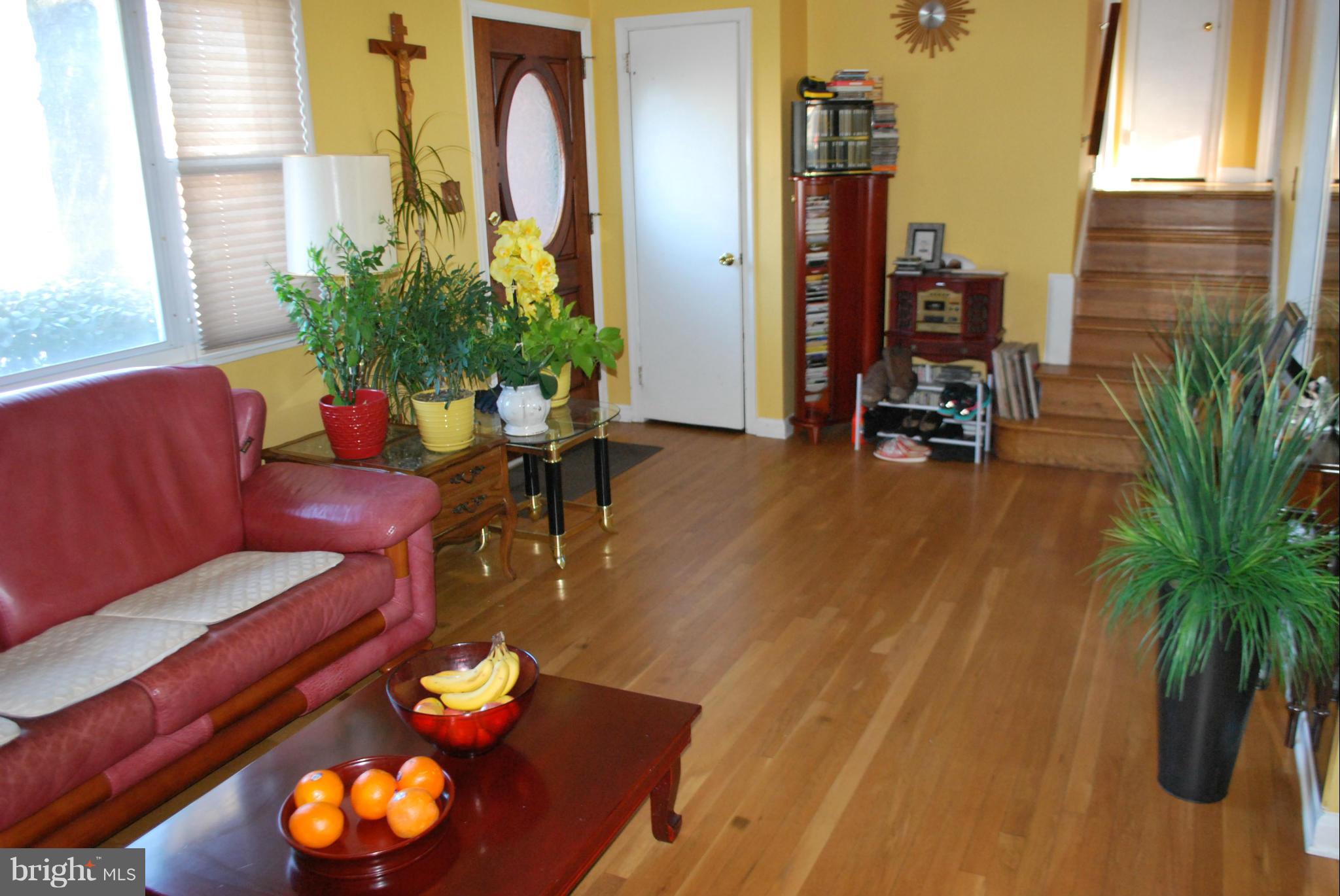 6833 Inverness Drive Springfield, VA 22150 - Photo 6 of 30 a living room with furniture and a potted plant
